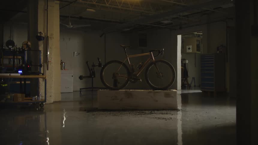 A bike on a stand in a dimly lit garage