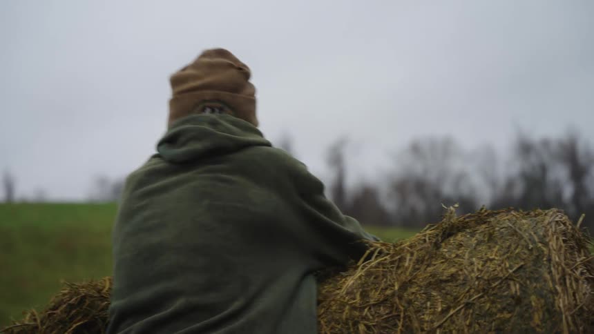 A man moves hay by the bulldozer
