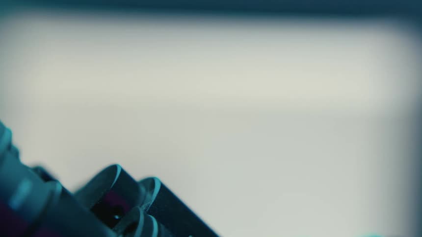 A woman is looking through a microscope