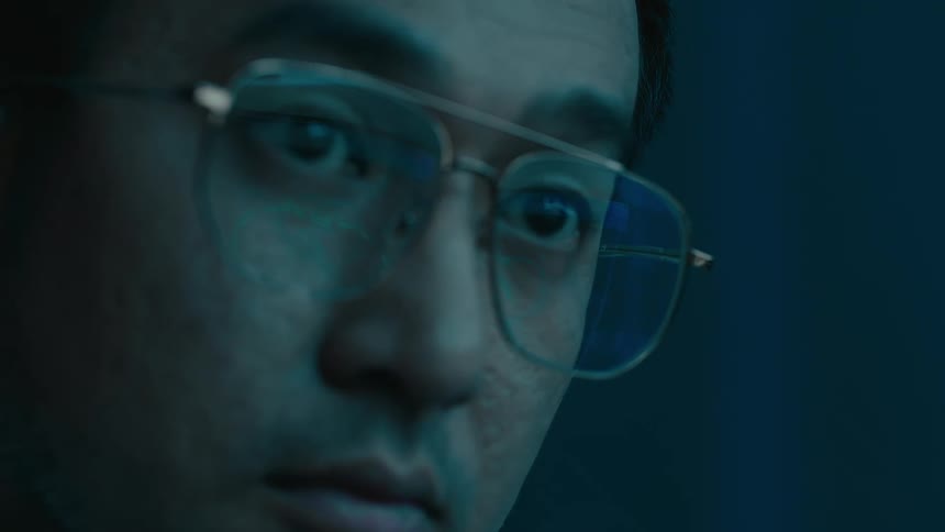 A man is looking around at something