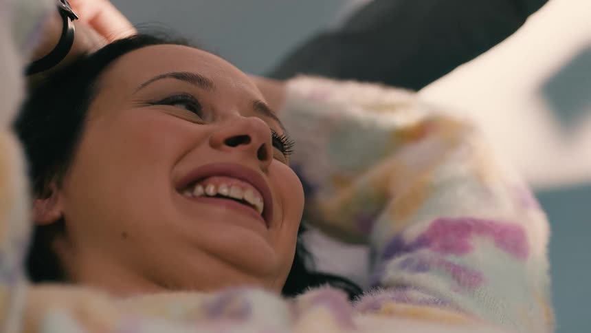 Portrait of a woman lying down smiling