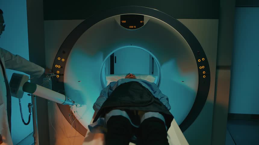 A doctor examining a patient in an mri machine