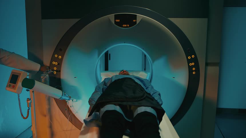 A person undergoing a ct scan in a hospital or clinic