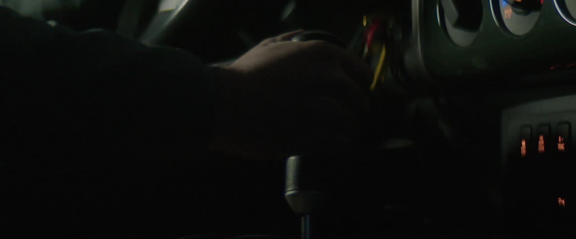A persons hand pulling a lever