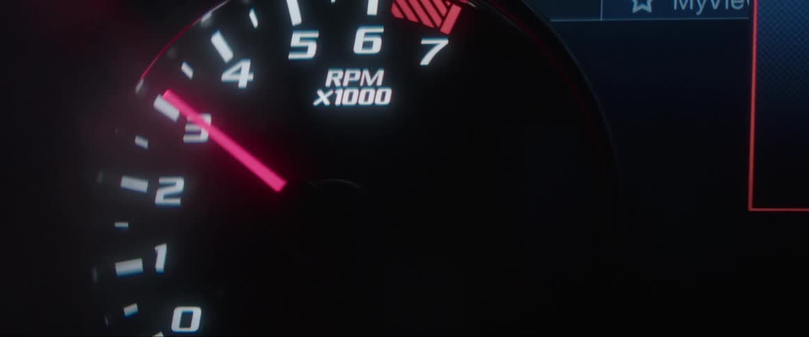 Extreme close up on a car odometer going up in power