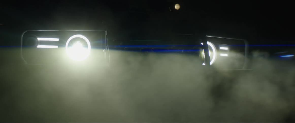 Front view of a pickup truck with headlights on at night in a foggy day