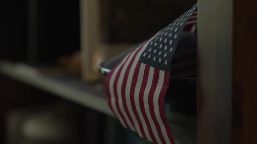 Small united states flag on the corner of a cabinet