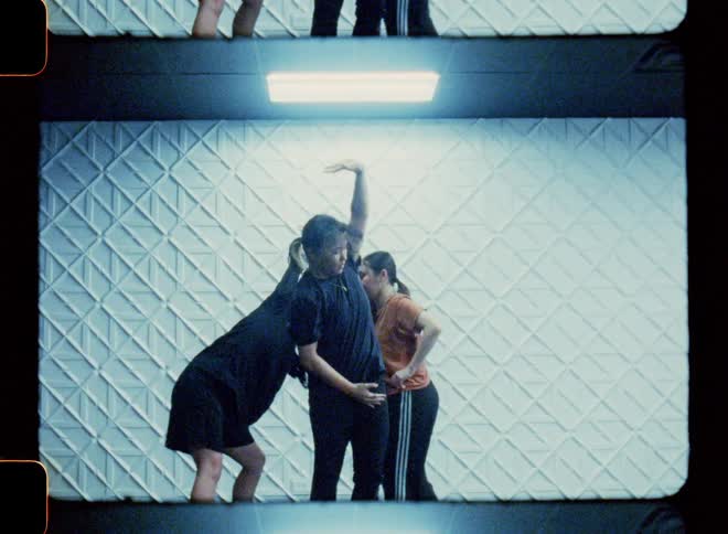 Dancers inside a studio performing together
