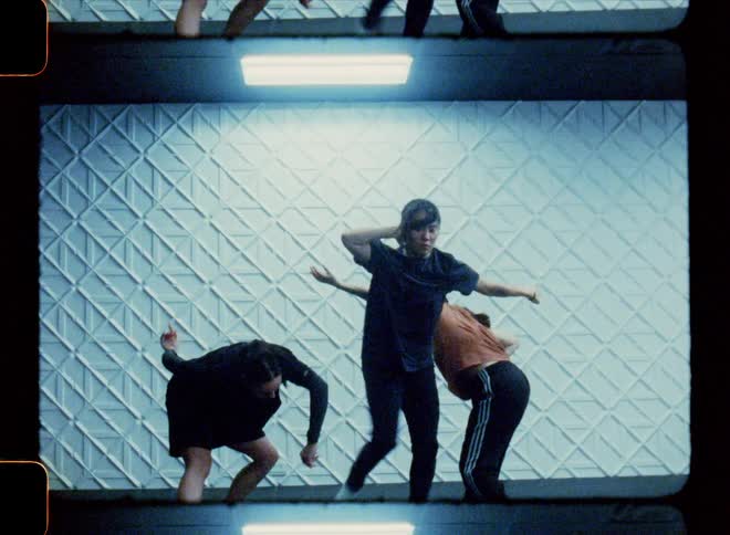 Dancers inside a studio performing together