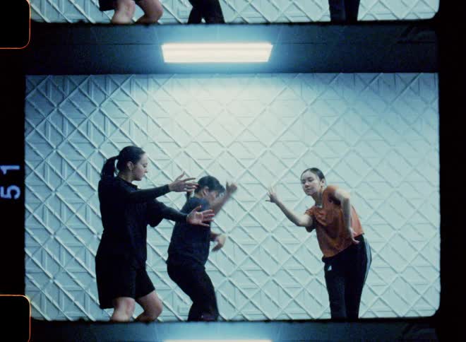 Dancers in a studio performing together