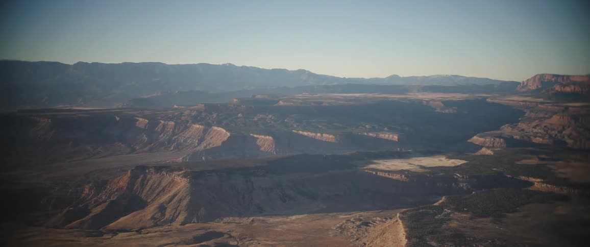 Natural landscape of canyons plateaus and mountains in cloudless blue sky day