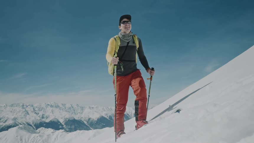 A skier climbs up a slope