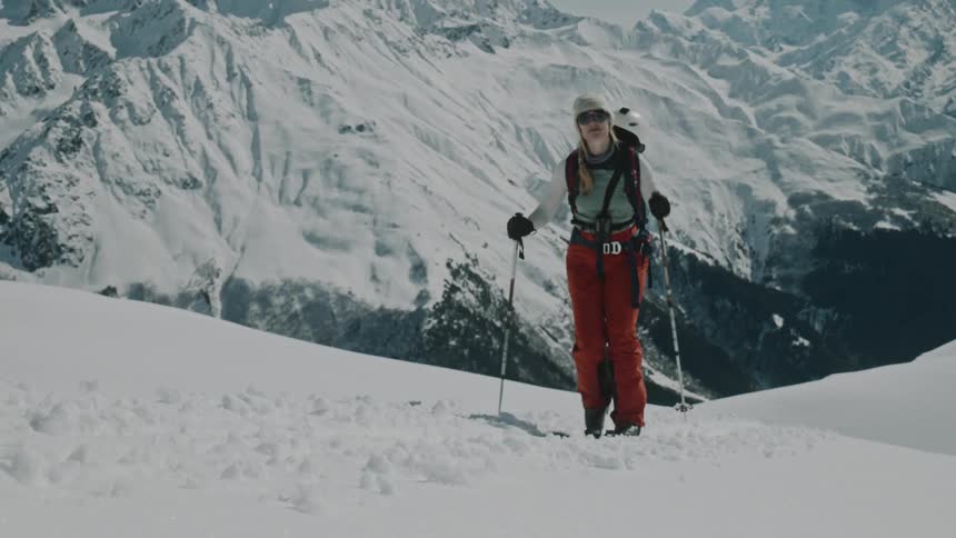 Two people with skitouring a steep mountain
