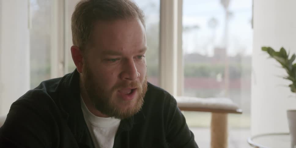A man sitting in a room talking