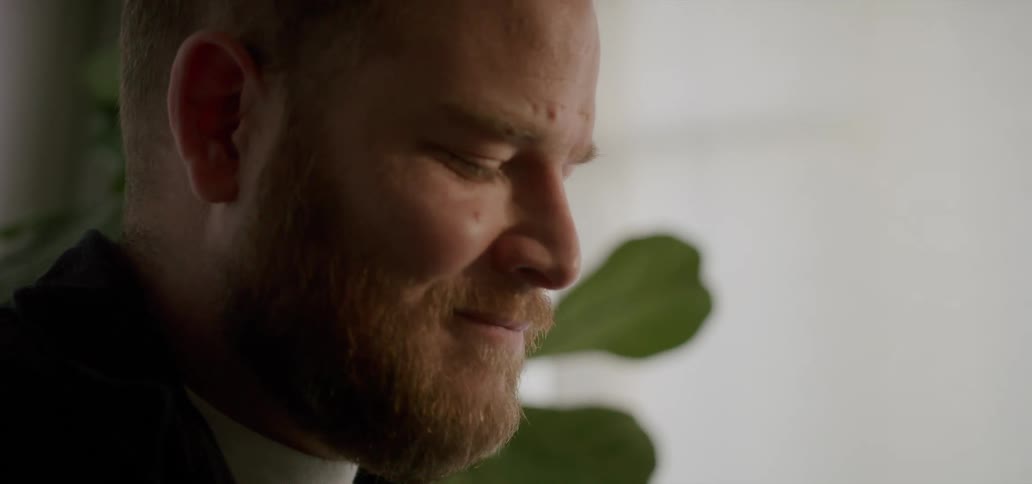 A man is smiling at home