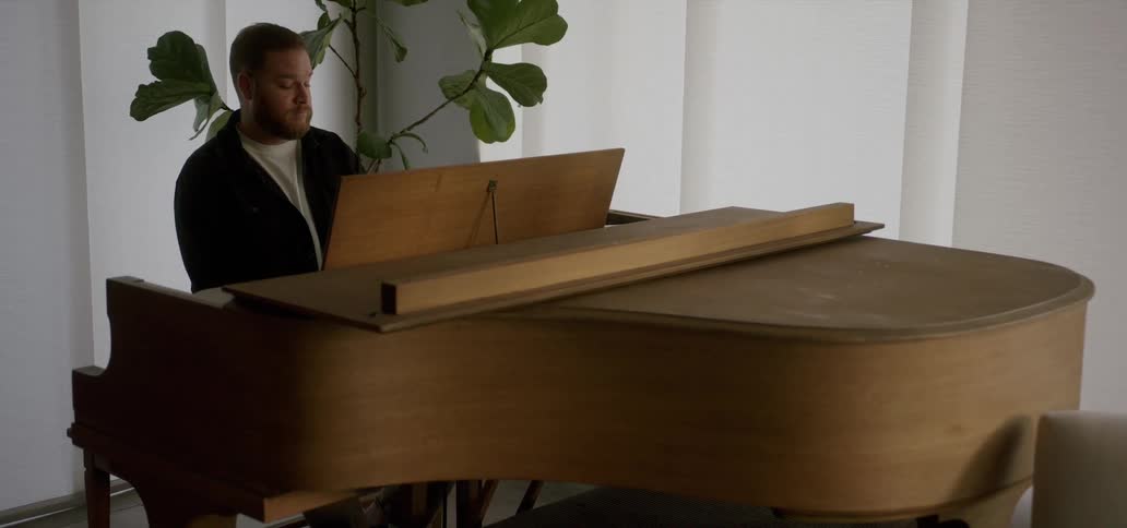 A man is playing the piano