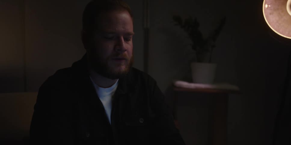 A man is sitting at home