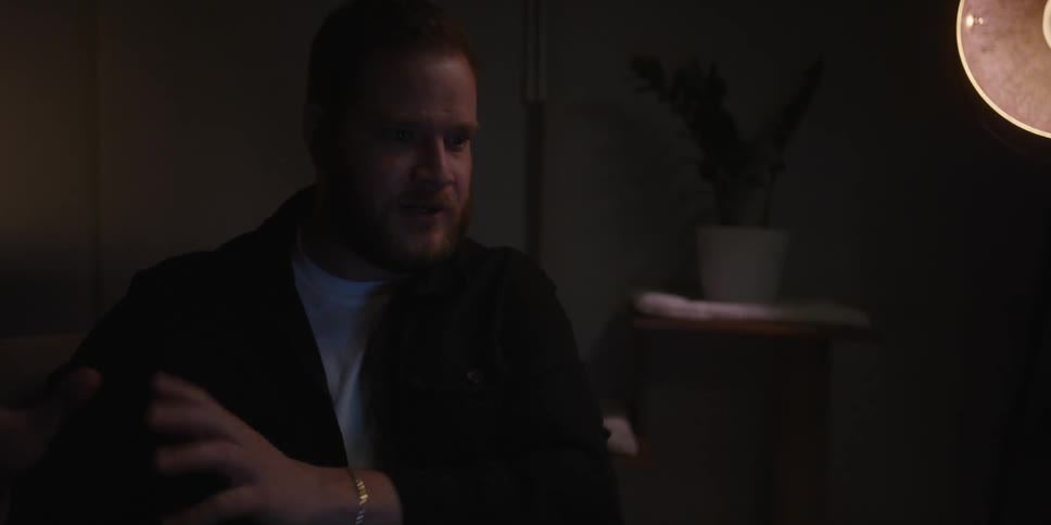 A man speaks and gestures with his hands