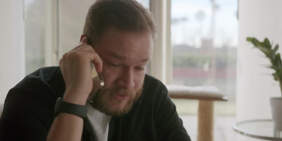 Upset man talking on the phone