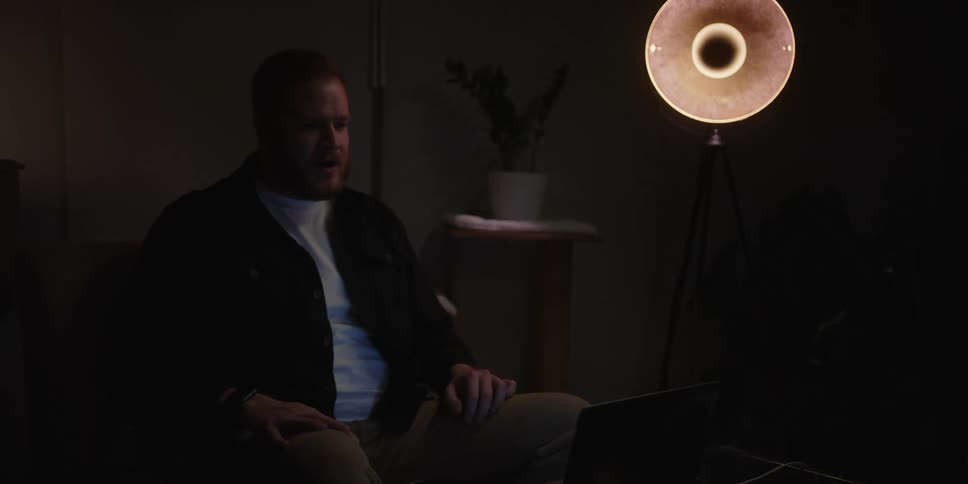 A man having a conversation on a laptop