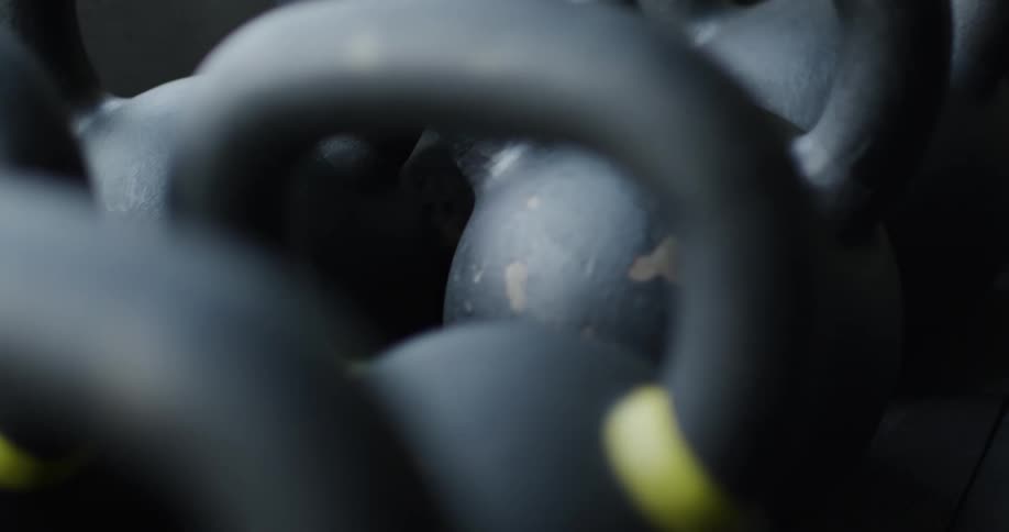 A row of kettle bells are in the gym