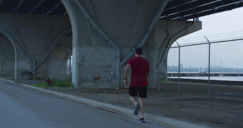A man runs down a city street