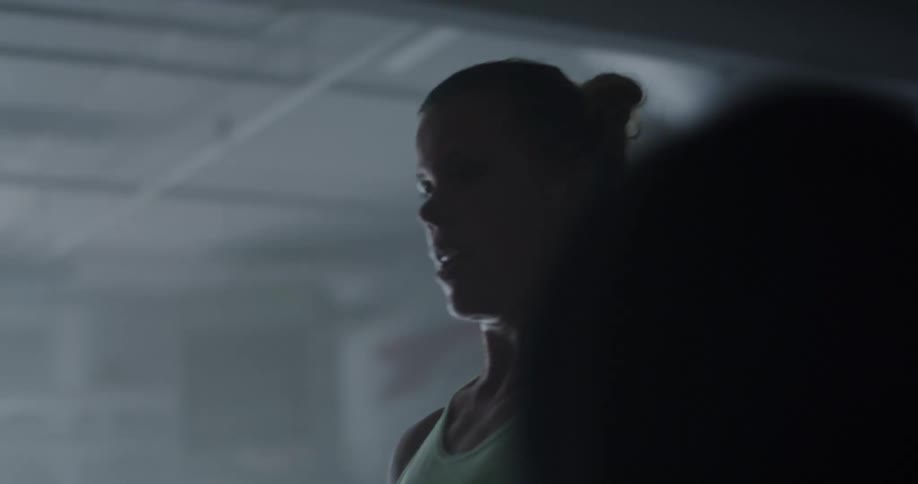 Woman performing weightlifting on bar