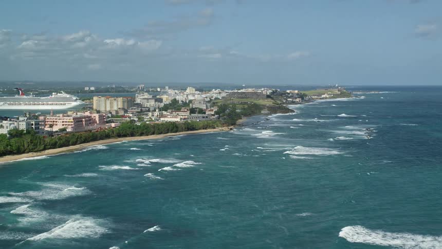 Waves travel towards the shore of the island