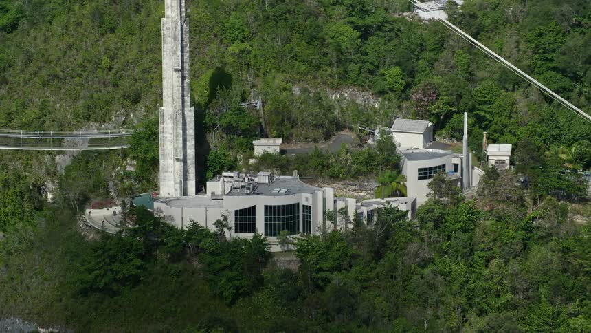 A mansion has a bridge on the mountain