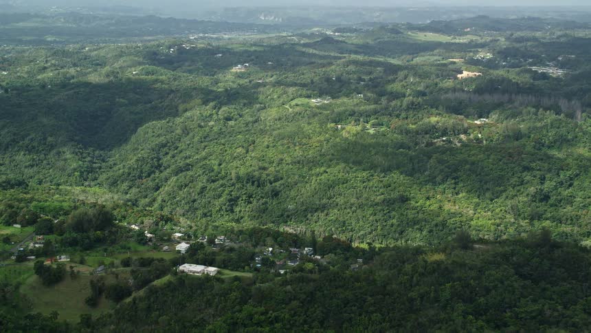 Aerial panorama of a chain of hills and mountains with forests
