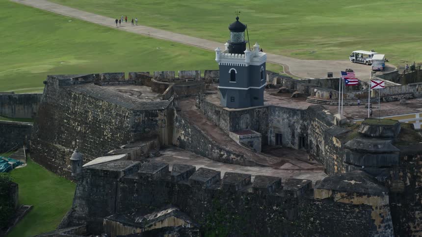 People are touring the castle on the shore