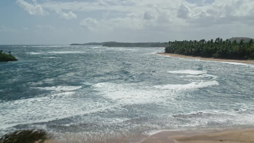 Aerial view of a coastline with small islands nearby