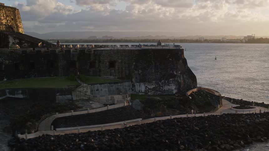 Aerial view of a seaside fort with late afternoon cloudy sky