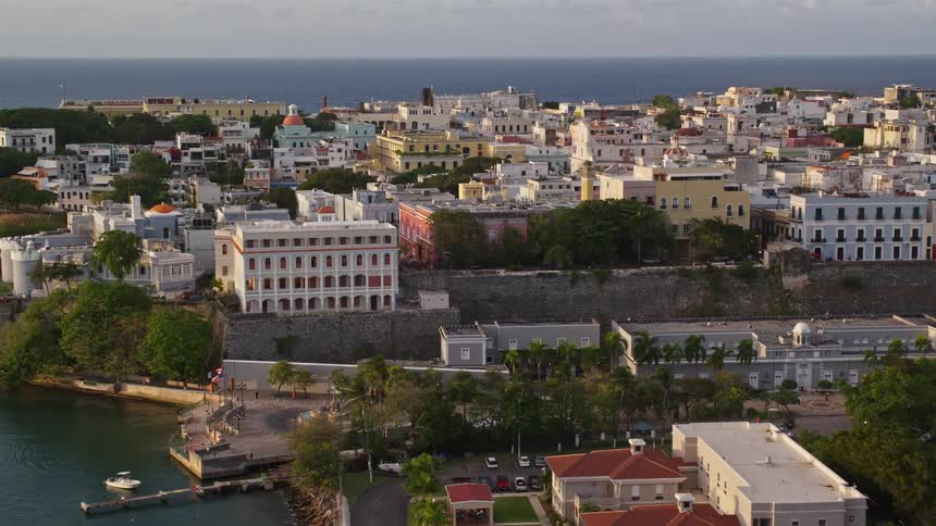 A small city sits on a peninsula on the coast