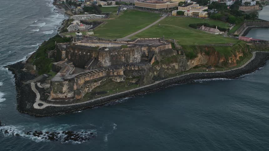 An ancient and large fort sits on a headland coast