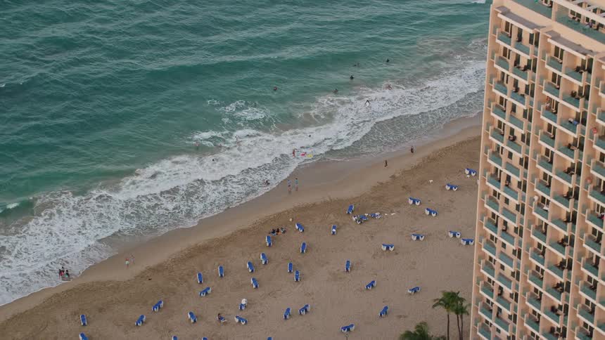 Hotel resorts sit right next to a beach area