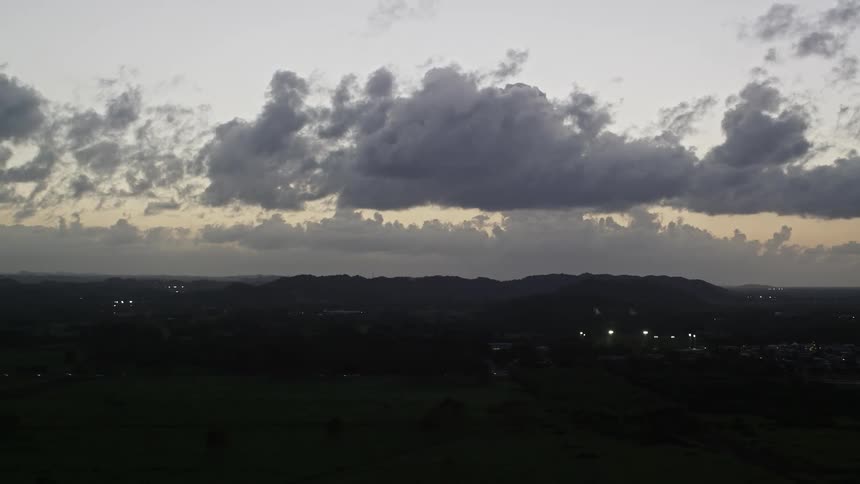 The landscape is dark at dusk
