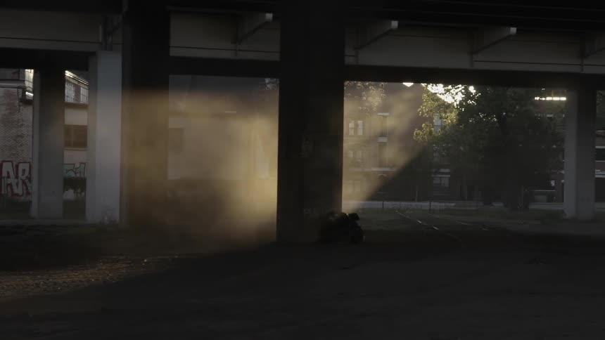 Underneath a deserted city bridge