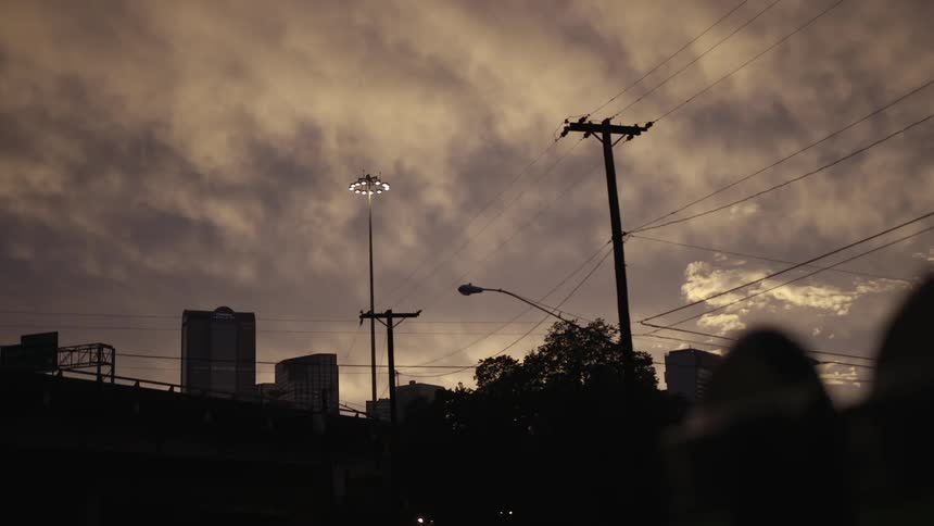 View of a city at a cloudy sunset
