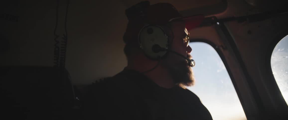 A man pilots a plane