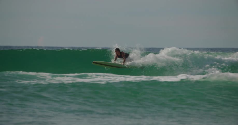 Men are surfing waves in the ocean
