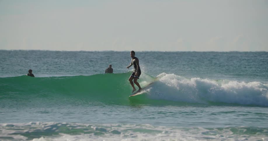 Man surfing a small wave