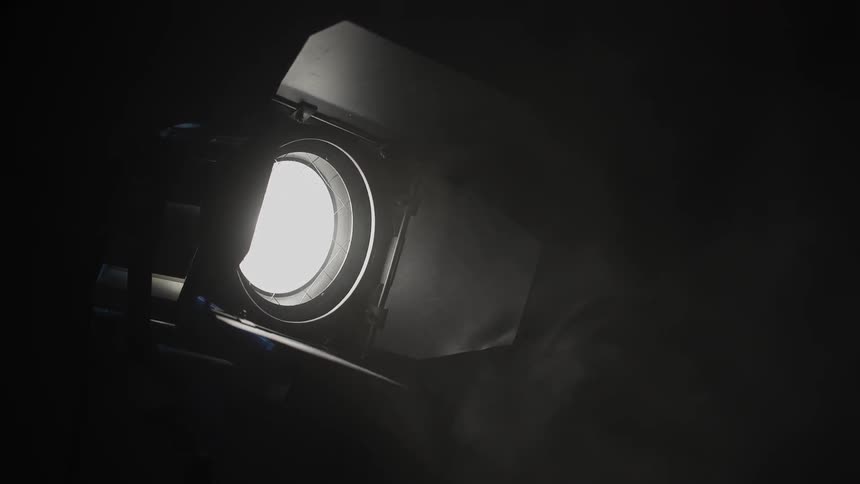 Spotlight turning on at night