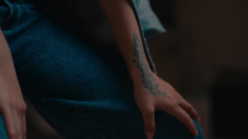 A person has a tattoo on their arm