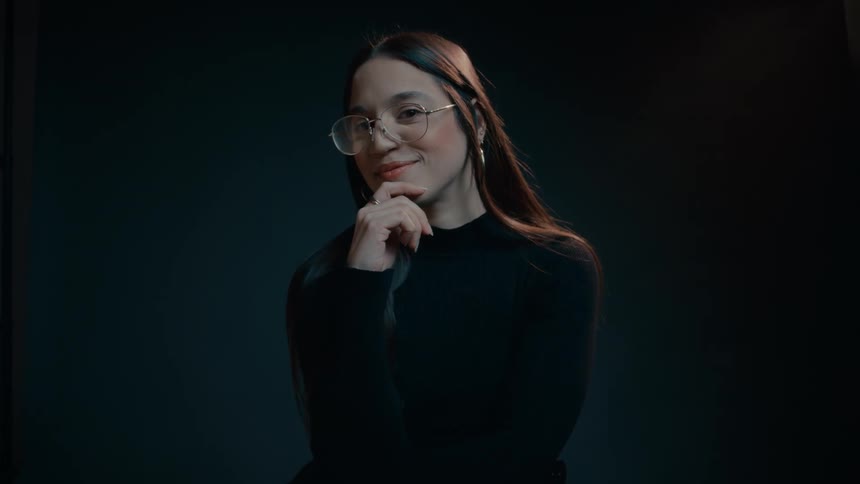 A model smiles as she poses