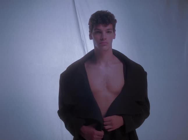 A man is modeling a coat