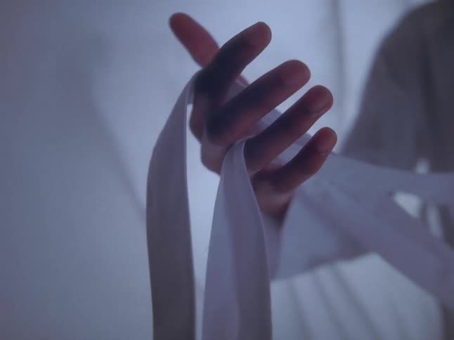 A man is modeling white clothing