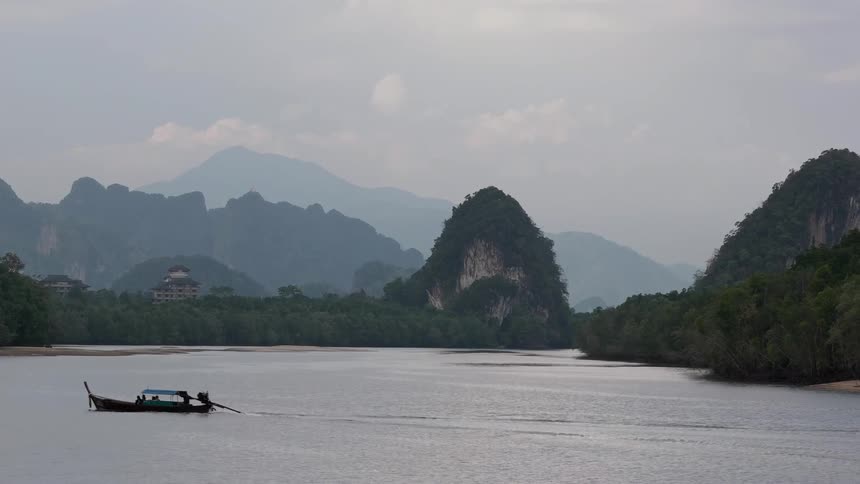 A boat floats on a mountain lake