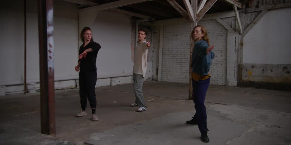 Three teenagers dance together