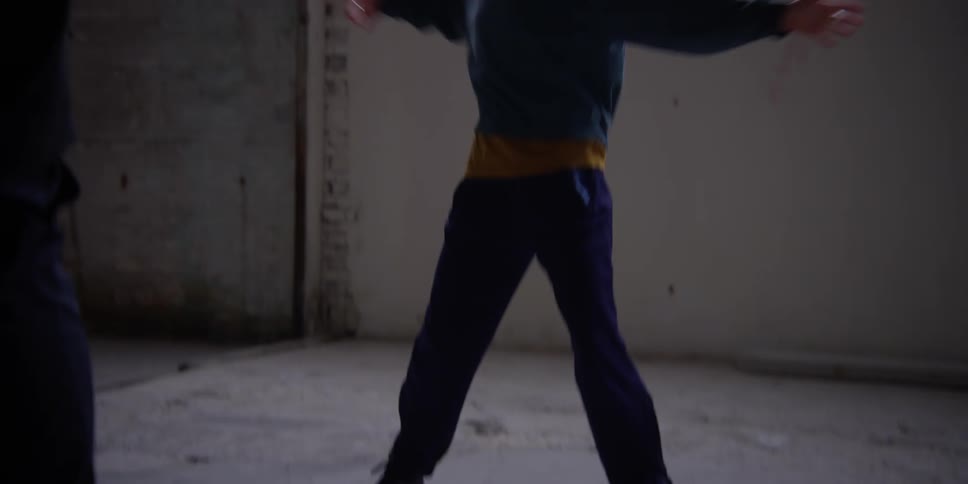 Two women practicing a dance choreography